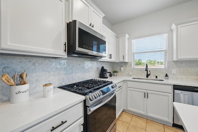 8048 Crimea Ln, Fort Worth, TX 76123 - kitchen featuring stainless steel appliances, a sink, white cabinetry, light countertops, and light tile patterned floors