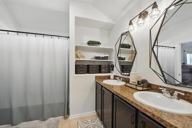 8048 Crimea Ln, Fort Worth, TX 76123 - full bathroom with double vanity, tile patterned flooring, curtained shower, and vaulted ceiling