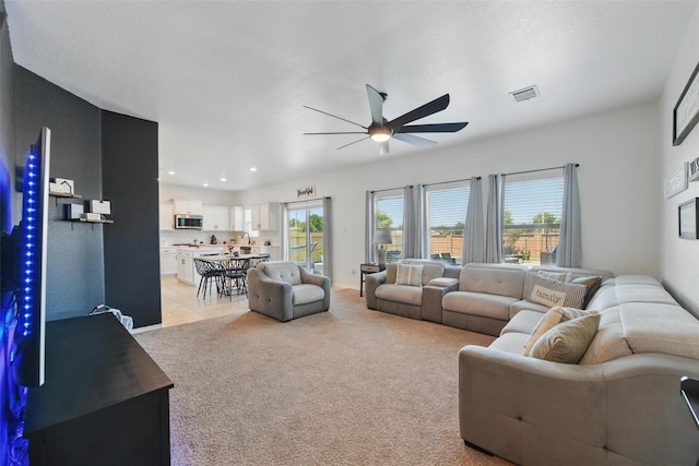 8048 Crimea Ln, Fort Worth, TX 76123 - living area featuring ceiling fan, healthy amount of natural light, light colored carpet, and recessed lighting