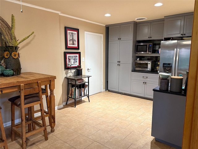 3833 Wilkie Way, Fort Worth, TX 76133 - kitchen featuring appliances with stainless steel finishes, crown molding, recessed lighting, light tile patterned floors, and gray cabinetry