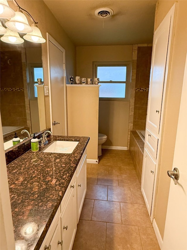 3833 Wilkie Way, Fort Worth, TX 76133 - bathroom with toilet, vanity, baseboards, and tile patterned floors