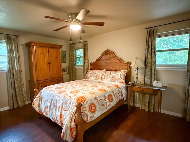 3833 Wilkie Way, Fort Worth, TX 76133 - bedroom with multiple windows, baseboards, and dark wood finished floors