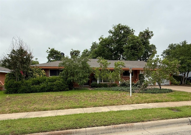 3833 Wilkie Way, Fort Worth, TX 76133 - view of front of house with a front yard and driveway