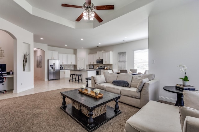15616 Rockingham St, Frisco, TX 75036 - living area featuring arched walkways, ceiling fan, baseboards, and recessed lighting