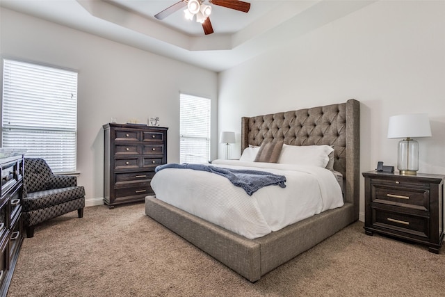 15616 Rockingham St, Frisco, TX 75036 - bedroom with light carpet, a ceiling fan, a tray ceiling, and baseboards