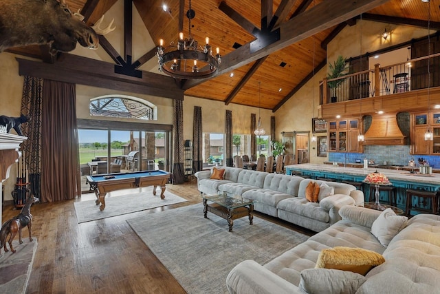 5900 Florance Rd, Northlake, TX 76247 - living area with high vaulted ceiling, wood ceiling with exposed beams, wood-type flooring, pool table, and a chandelier