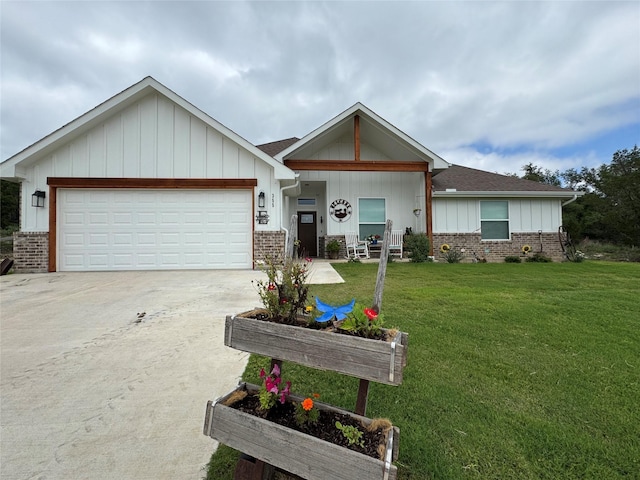 355 Sunset Cv, Bluff Dale, TX 76433 - view of front of home featuring board and batten siding, brick siding, a front yard, and concrete driveway