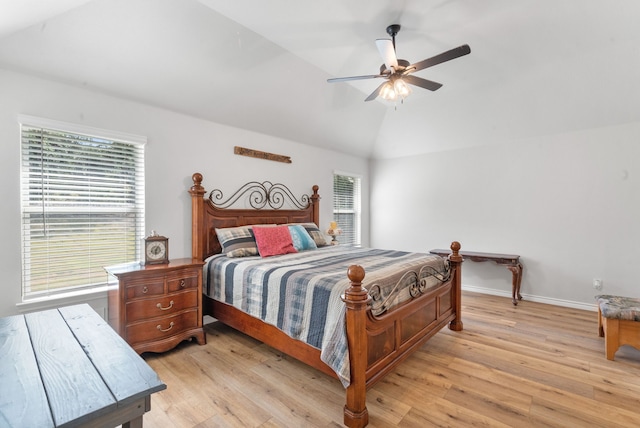 355 Sunset Cv, Bluff Dale, TX 76433 - bedroom with multiple windows, light wood-style floors, vaulted ceiling, and a ceiling fan