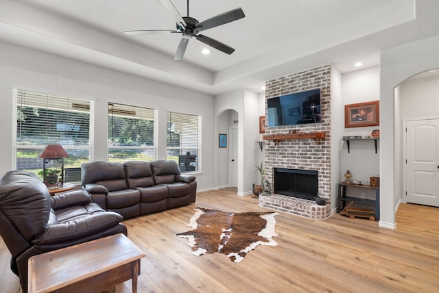 355 Sunset Cv, Bluff Dale, TX 76433 - living area with arched walkways, a raised ceiling, light wood-style flooring, ceiling fan, and recessed lighting