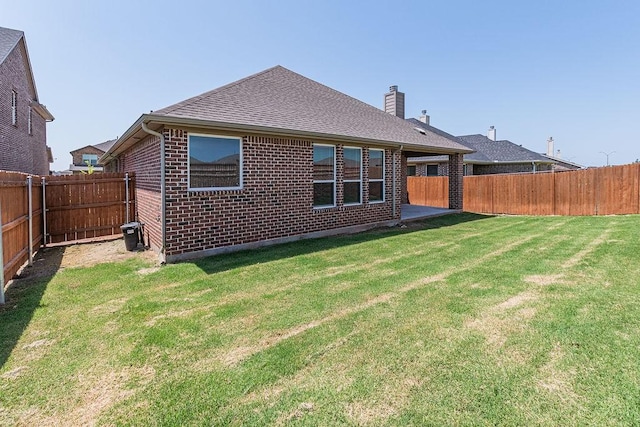 1800 Star Fleet Dr, Haslet, TX 76052 - back of house with brick siding, a chimney, and roof with shingles