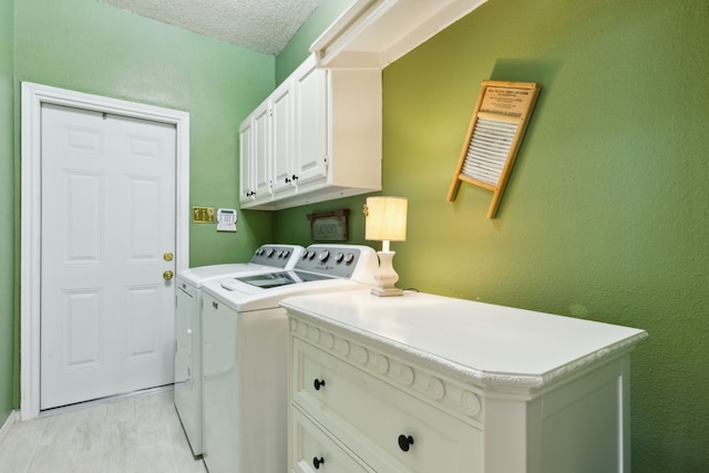 4055 Seabury Dr, Dallas, TX 75287 - laundry room with separate washer and dryer, cabinet space, light wood-type flooring, and a textured ceiling