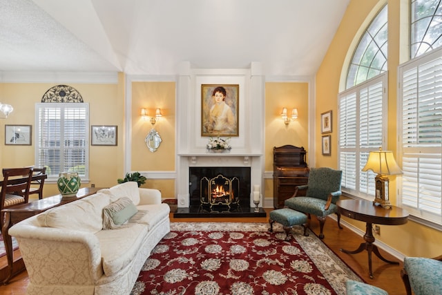 4055 Seabury Dr, Dallas, TX 75287 - living room with plenty of natural light, a warm lit fireplace, and wood finished floors