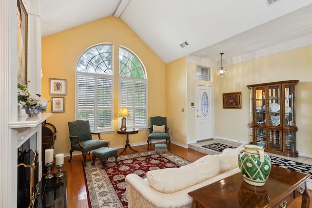 4055 Seabury Dr, Dallas, TX 75287 - living room with wood finished floors, baseboards, a fireplace, and high vaulted ceiling