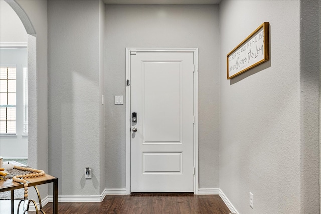 457 Silverstone Dr, Waxahachie, TX 75165 - entryway with arched walkways, dark wood-type flooring, and baseboards