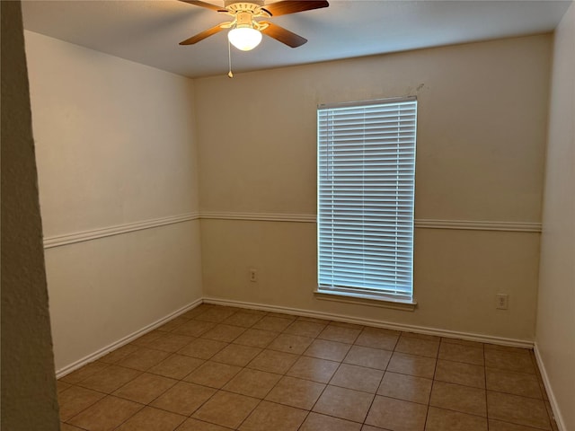 2825 Saint Croix Ave, Lancaster, TX 75134 - spare room featuring ceiling fan, baseboards, and tile patterned floors