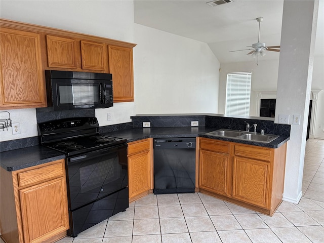 2825 Saint Croix Ave, Lancaster, TX 75134 - kitchen featuring black appliances, a sink, vaulted ceiling, light tile patterned floors, and ceiling fan
