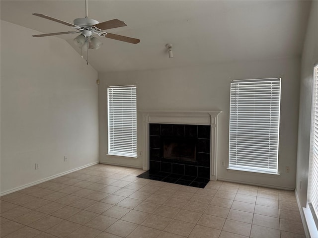 2825 Saint Croix Ave, Lancaster, TX 75134 - unfurnished living room featuring lofted ceiling, tile patterned flooring, a ceiling fan, and baseboards