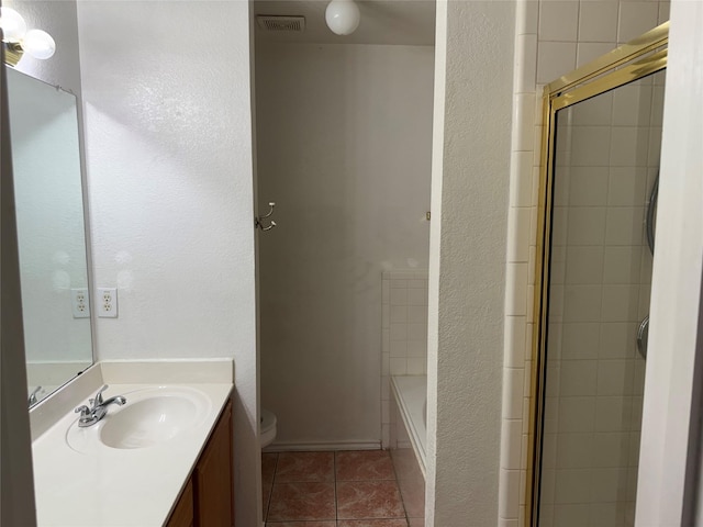 2825 Saint Croix Ave, Lancaster, TX 75134 - bathroom with vanity, tile patterned flooring, toilet, and a textured wall