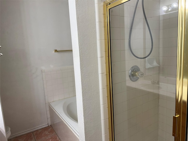 2825 Saint Croix Ave, Lancaster, TX 75134 - full bath featuring a shower stall, a garden tub, tile patterned floors, toilet, and a textured wall