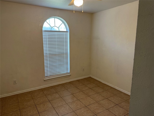 2825 Saint Croix Ave, Lancaster, TX 75134 - spare room featuring ceiling fan, tile patterned flooring, and baseboards