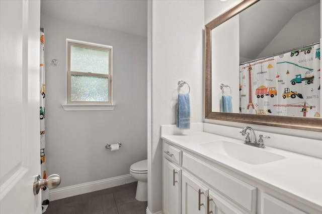 309 Bluffside Trl, Benbrook, TX 76126 - bathroom with vanity, tile patterned floors, toilet, baseboards, and vaulted ceiling