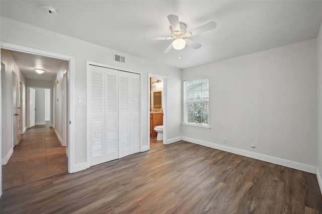 5833 Westhaven Dr, Fort Worth, TX 76132 - unfurnished bedroom featuring baseboards, wood finished floors, a closet, ensuite bathroom, and ceiling fan