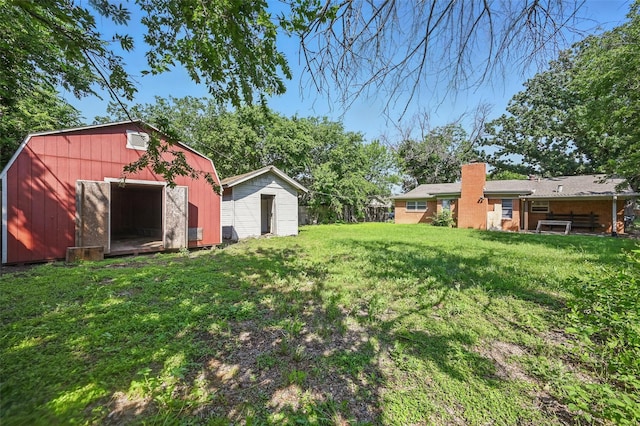 5833 Westhaven Dr, Fort Worth, TX 76132 - view of grassy yard featuring an outbuilding