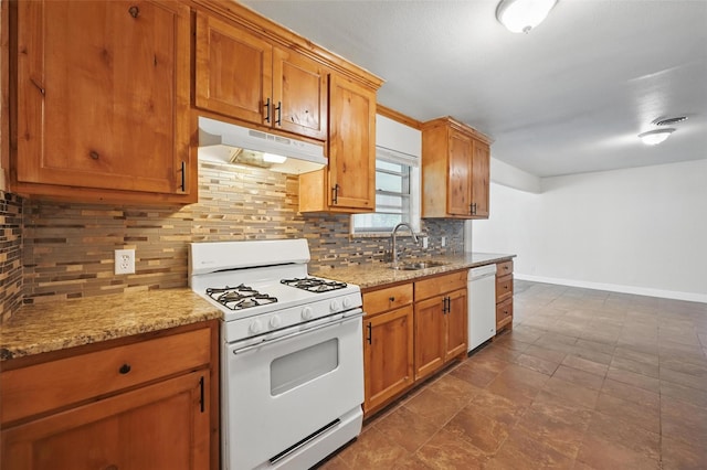 5833 Westhaven Dr, Fort Worth, TX 76132 - kitchen with white appliances, under cabinet range hood, a sink, and decorative backsplash