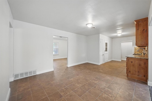 5833 Westhaven Dr, Fort Worth, TX 76132 - unfurnished living room with a sink and baseboards