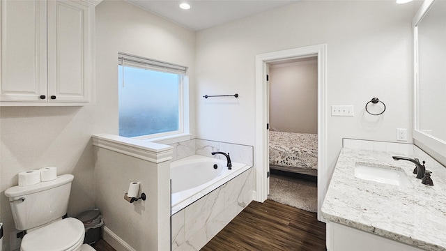 7349 Wildflower Way, Abilene, TX 79602 - bathroom with vanity, a bath, toilet, wood finished floors, and recessed lighting