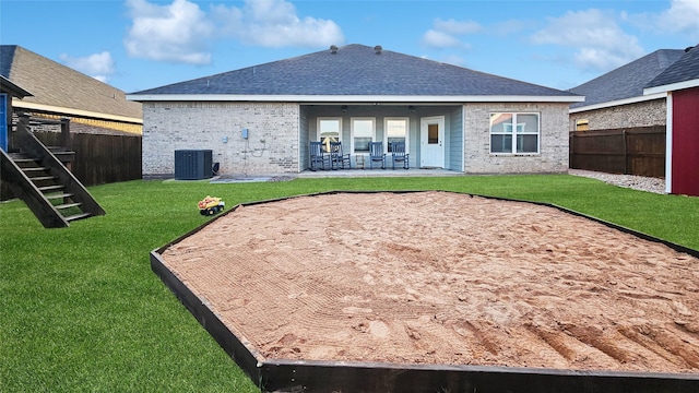 7349 Wildflower Way, Abilene, TX 79602 - rear view of house featuring central AC unit, brick siding, and a patio area