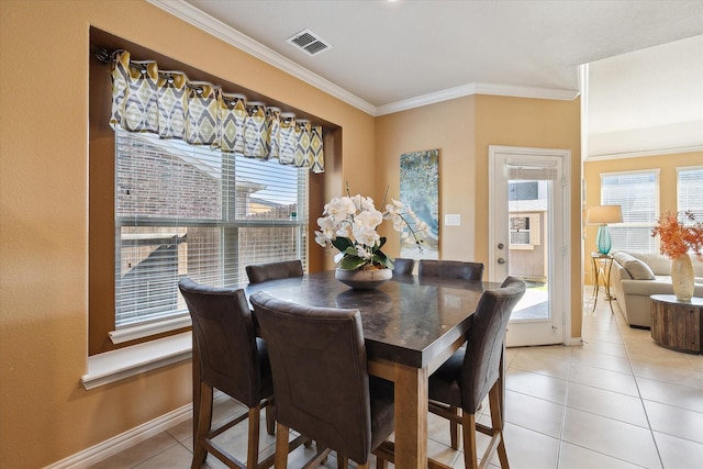 200 Baldwin Dr, Fate, TX 75189 - dining area with ornamental molding, plenty of natural light, light tile patterned floors, and baseboards