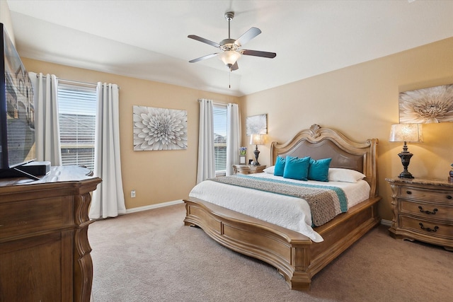 200 Baldwin Dr, Fate, TX 75189 - bedroom featuring light carpet, multiple windows, baseboards, and ceiling fan