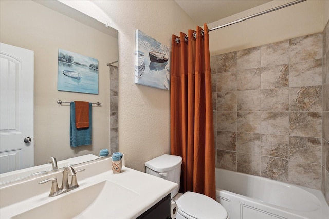 200 Baldwin Dr, Fate, TX 75189 - bathroom featuring vanity, toilet, shower / bathtub combination with curtain, and a textured wall