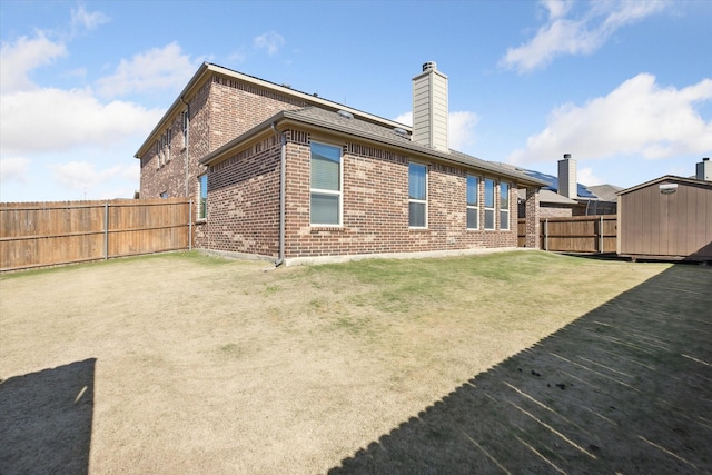200 Baldwin Dr, Fate, TX 75189 - rear view of property featuring brick siding and a chimney