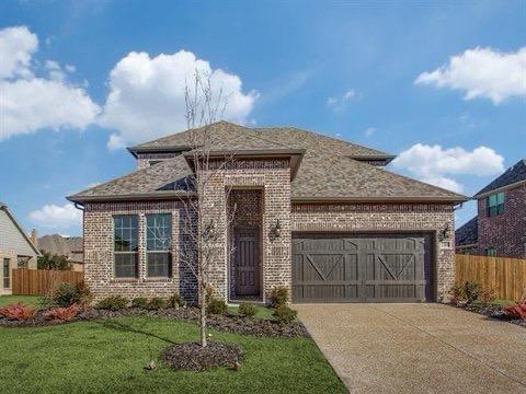 1301 Cold Stream Dr, Wylie, TX 75098 - view of front of property featuring brick siding, a garage, concrete driveway, and roof with shingles