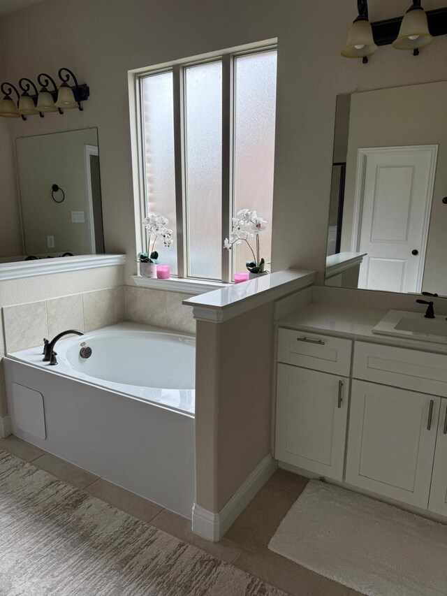 1301 Cold Stream Dr, Wylie, TX 75098 - full bath with tile patterned floors, a garden tub, and vanity