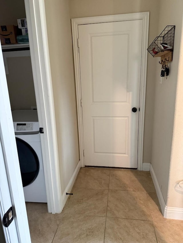 1301 Cold Stream Dr, Wylie, TX 75098 - laundry area with washer / clothes dryer, baseboards, and light tile patterned floors