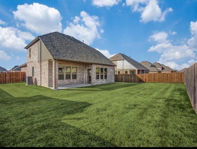 1301 Cold Stream Dr, Wylie, TX 75098 - rear view of house featuring brick siding