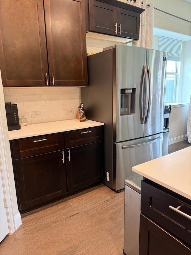 1301 Cold Stream Dr, Wylie, TX 75098 - kitchen featuring stainless steel refrigerator with ice dispenser, backsplash, light countertops, and dark brown cabinets