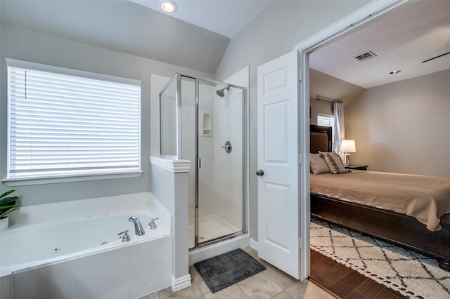 3526 Washington Dr, Frisco, TX 75034 - full bathroom with connected bathroom, vaulted ceiling, a tub with jets, and a shower stall