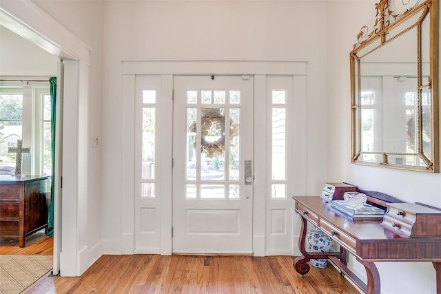 2913 Willing Ave, Fort Worth, TX 76110 - entrance foyer featuring light wood finished floors, healthy amount of natural light, and baseboards