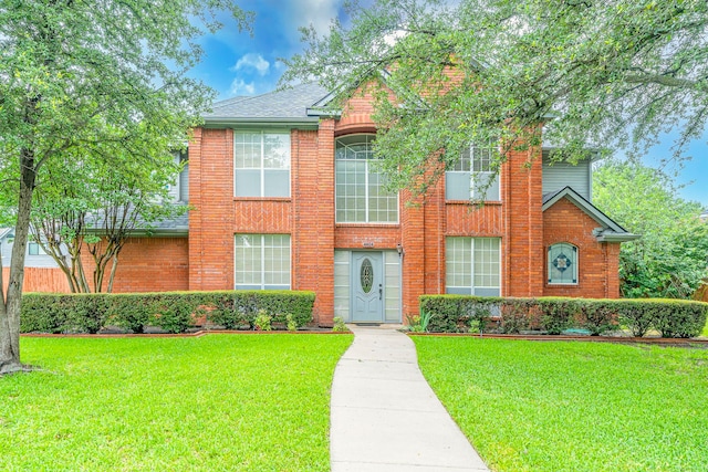 4404 Bentley Dr, Plano, TX 75093 - view of front facade with a front lawn and brick siding