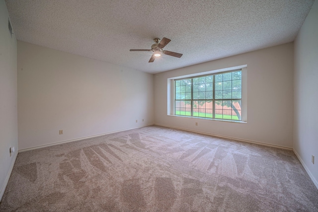 4404 Bentley Dr, Plano, TX 75093 - carpeted spare room featuring ceiling fan, a textured ceiling, and baseboards