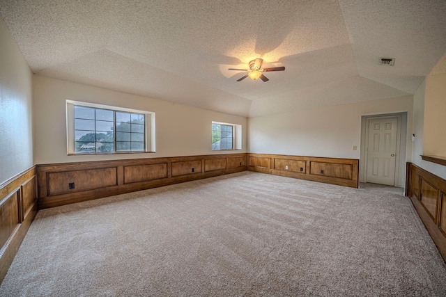4404 Bentley Dr, Plano, TX 75093 - spare room with a wainscoted wall, ceiling fan, carpet, a textured ceiling, and a tray ceiling