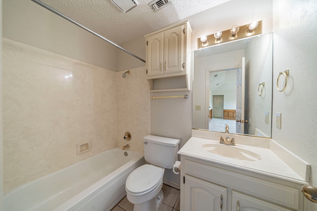 4404 Bentley Dr, Plano, TX 75093 - full bath featuring a textured ceiling, tub / shower combination, toilet, vanity, and tile patterned floors