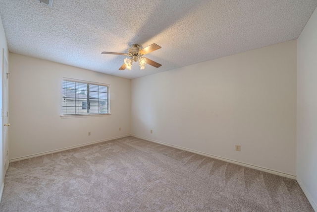 4404 Bentley Dr, Plano, TX 75093 - spare room with light carpet, a ceiling fan, a textured ceiling, and baseboards
