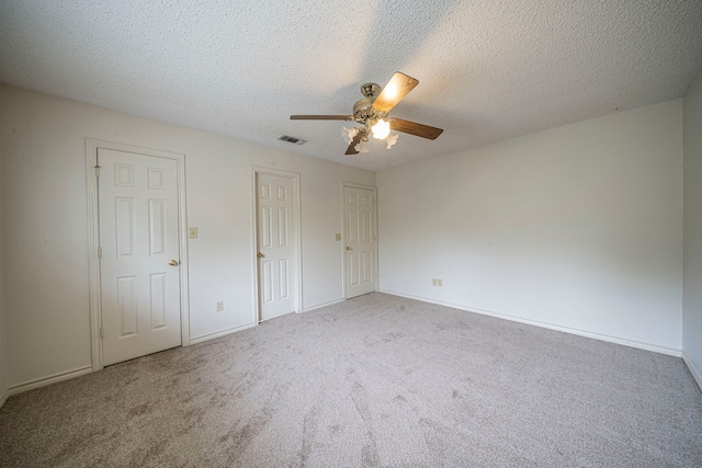 4404 Bentley Dr, Plano, TX 75093 - unfurnished bedroom featuring carpet flooring, a ceiling fan, baseboards, and a textured ceiling
