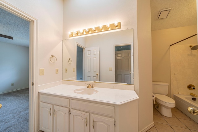 4404 Bentley Dr, Plano, TX 75093 - bathroom featuring vanity, toilet, tub / shower combination, a textured ceiling, and tile patterned flooring