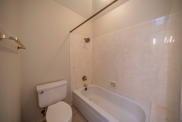 4404 Bentley Dr, Plano, TX 75093 - bathroom featuring toilet, a textured ceiling, shower / bath combination, and tile patterned floors